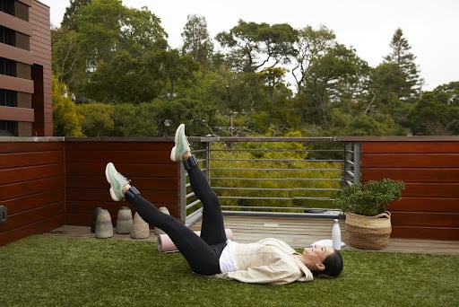 woman exercising in her back yard