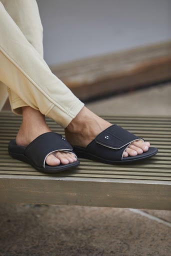 Man wearing orthotic sandals